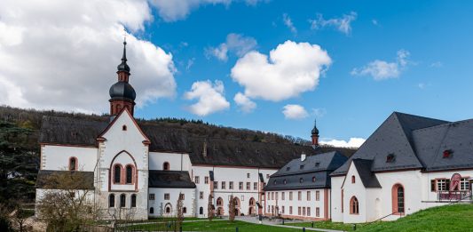 Getaway to Germany’s Rheingau wine region A medieval abbey, white with brick trimmed windows and an onion-shaped tower